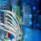 Industrial-grade networking equipment installed in a manufacturing facility with structured cabling and rugged wireless access points.